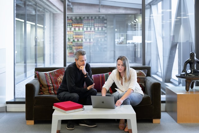 Real estate professional using a laptop for presentation