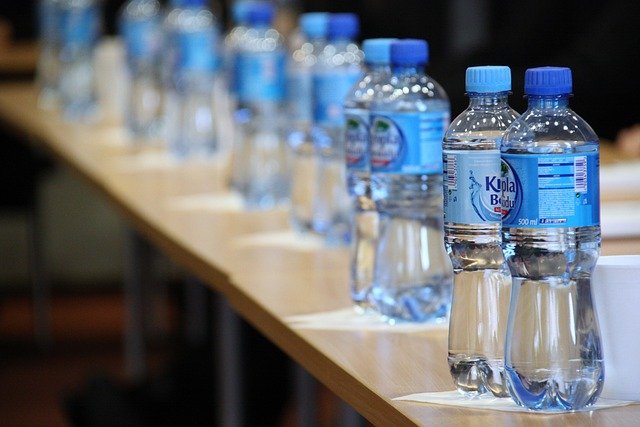 Water bottles with blue labels on them